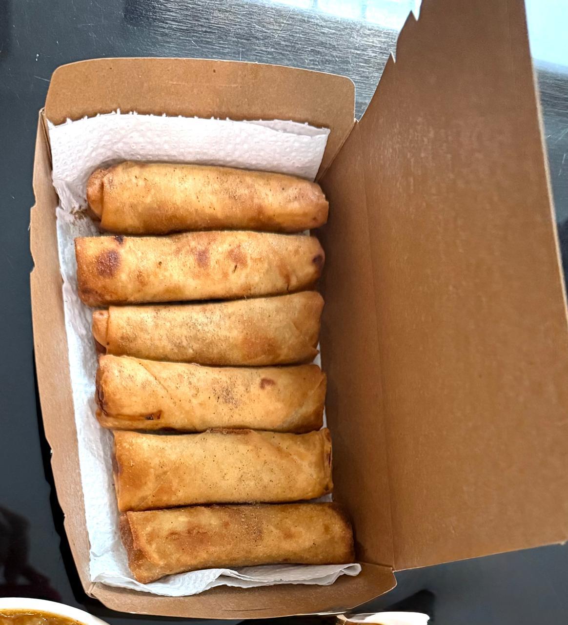 Six spring rolls packed in a lined kraft box
