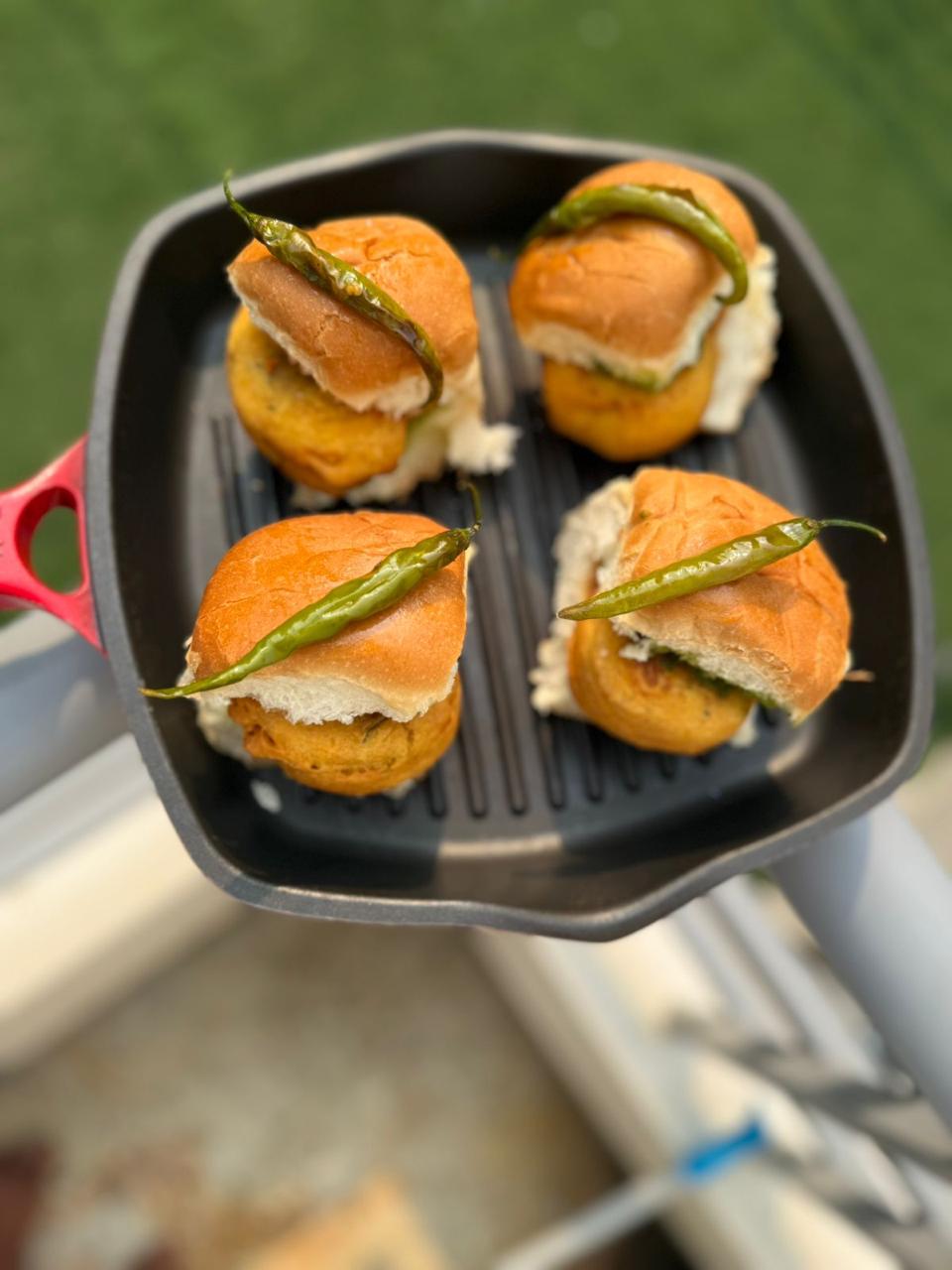Vada pao on a grill pan, photographed from above